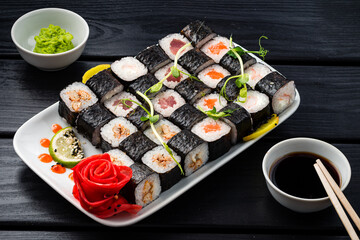 Classic Japanese sushi roll hosomaki with tuna, salmon and shrimp