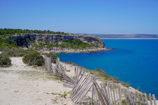 wooden fence coast protect fall coastal cliff in mediterranean in Occitanie southeast france