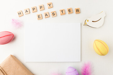 Blank template for postcard, greetings and congratulations on a white wooden stand with Easter decorations, holiday mockup.