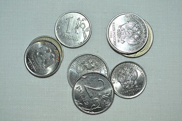 Russian coins in denominations of one and two rubles.