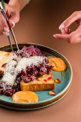 Close up view on served Steak beef tartare served with bread, sauce and salad. Restaurant food menu. European cuisine