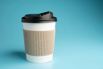 paper coffee cup on blue background