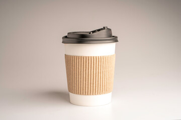 paper coffee cup on grey background