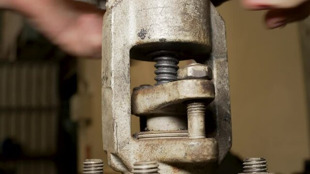 opens the stem of a metal wedge valve through which fluid must flow. medium close-up