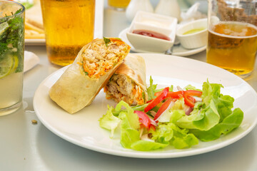 salad ,chicken and vegetables wrap.
