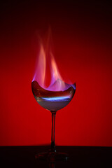 Burning goblet and dark background