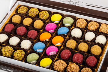 chocolate and colorful candies in a box