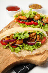 Concept of tasty food with pitas with chicken, close up