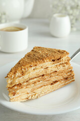 Concept of tasty dessert with honey cake, close up