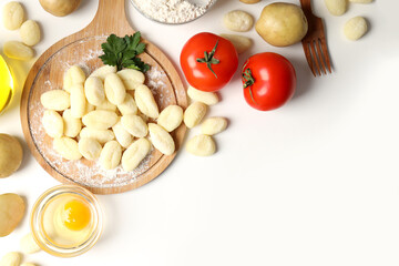 Concept of cooking with raw potato gnocchi, space for text