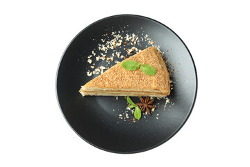 Plate with piece of honey cake isolated on white background