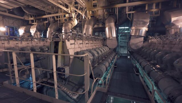 Engine room of vessel. Diesels. Large engine room on tanker. General plan
