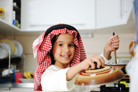 Little kid boy is cooking , high quality photos