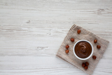 Homemade Chocolate Hazelnut Spread in a Bowl, top view. From above, overhead, flat lay.  Copy space.