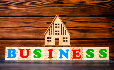  Wooden home and text on the cubes business
