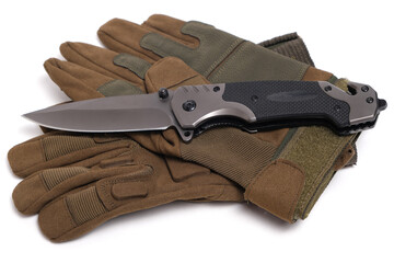 Folding knife and tactical military gloves on white background.