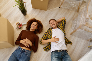 Happy couple on floor view from above
