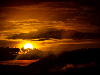 Fototapeta na wymiar Sunrise over The Mountain at Pha Chanadai Cliff