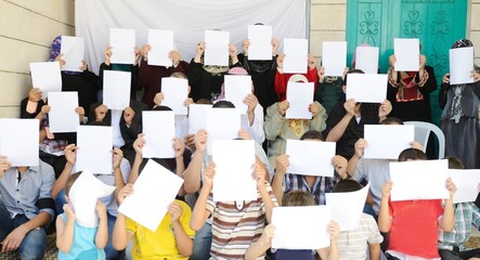 Crowd of people posing for portraits with blank
