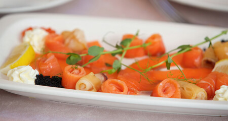 The food in the restaurant fish dish cutting of different types of fish and seafood on a platter
