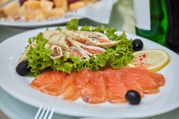 The food in the restaurant fish dish cutting of different types of fish and seafood on a platter