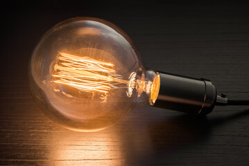 Vintage lightbulb on dark background