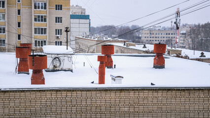 Naklejka premium Ventilation pipes on the roof of an apartment building