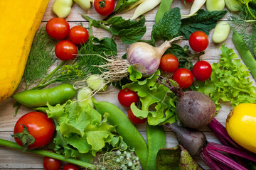 Autumn fresh vegetables on wooden table background