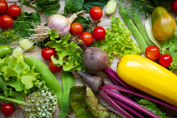 Autumn fresh vegetables on wooden table background