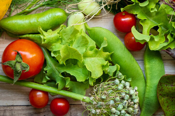 Autumn fresh vegetables on wooden table background