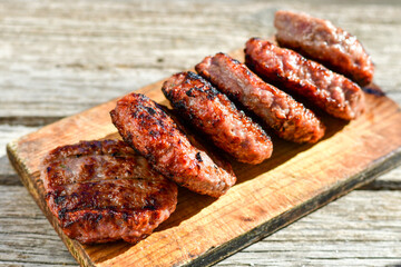 Home made Grilled pork meatballs  outdoor on wooden rustic background