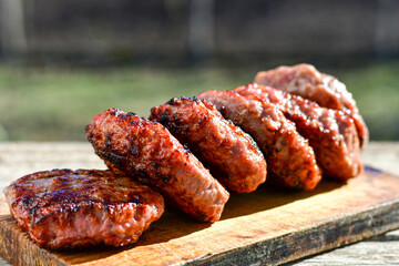 Home made Grilled pork meatballs  outdoor on wooden rustic background