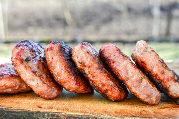 Home made Grilled pork meatballs  outdoor on wooden rustic background