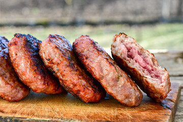 Home made Grilled pork meatballs  outdoor on wooden rustic background