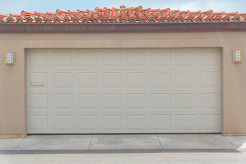 Garage exterior with sectional door and concrete tile roof at Carlsbad, San Diego, California