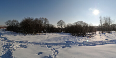 Winter walk through forests and fields, beautiful panorama.