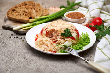 Delicious chicken aspic on a plate on concrete table