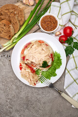 Delicious chicken aspic on a plate on concrete table