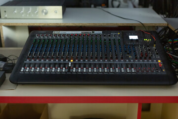 Television director's office with remote control and microphone, monitors, sensors, copy space