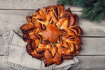 Christmas star bread on wood background. Rustic style