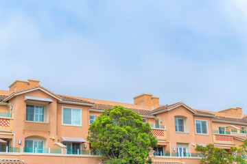 Fototapeta na wymiar Complex apartment building with glass railings on the balconies at Carlsbad, San Diego, California