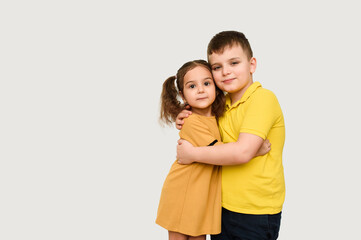 Two children brother and sister on white background.