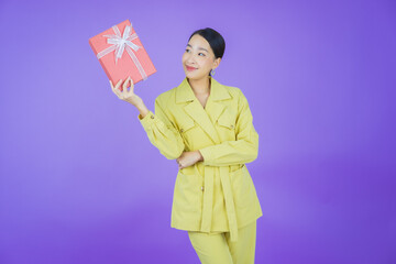 Portrait beautiful young asian woman smile with red gift box