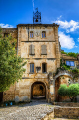 Fototapeta premium Bell Tower by the City Square of Oppede-le-Vieux, Provence, France