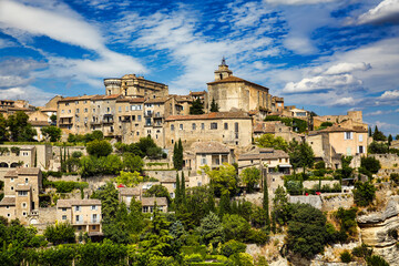 Fototapeta na wymiar The Castle and the Church of Saint Fermin (Firmin) Crowning the City of Gordes, Provence, France