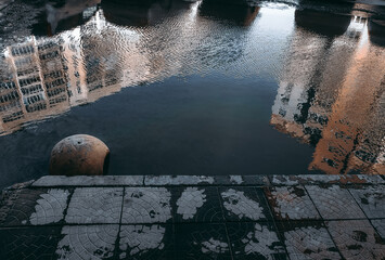 blurry reflection of houses in the water