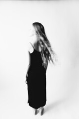 Fototapeta premium Art portrait of a girl in black and white. Light defocus and art noise on the frames