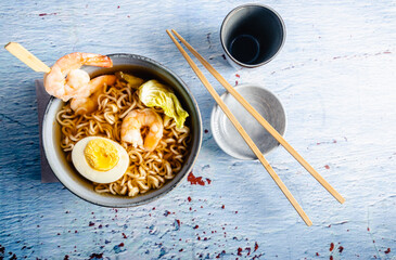Homemade japanese ramen. Homemade Japanese ramen with noodles and shrimps in a bowl and chopsticks.