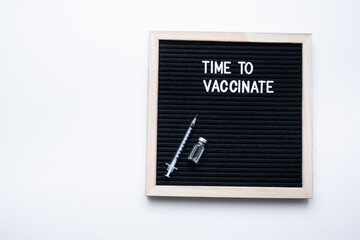 Time to vaccinate inscription on white background. Vaccination concept.