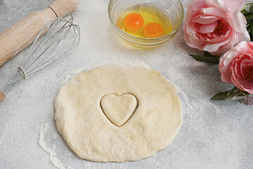 Valentine day baking background. Ingredients for cooking and Valentine's heart . Top view